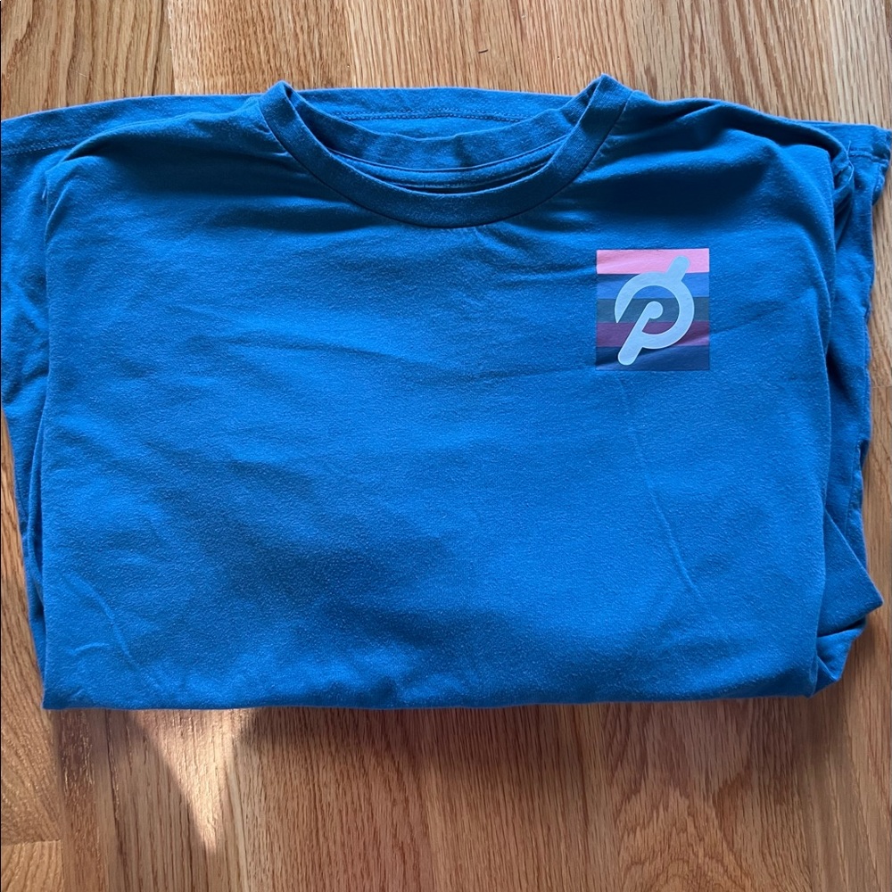 Teal blue long sleeved Peloton tee. Size M.